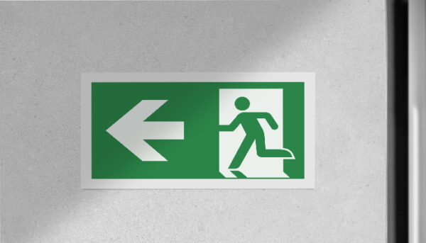 Fire exit sign in the corridor of the building.
